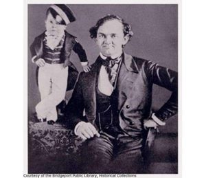 Two circus performers, a man with an infant sized man standing near him, courtesy of the Bridgeport Public Library Historical Collections