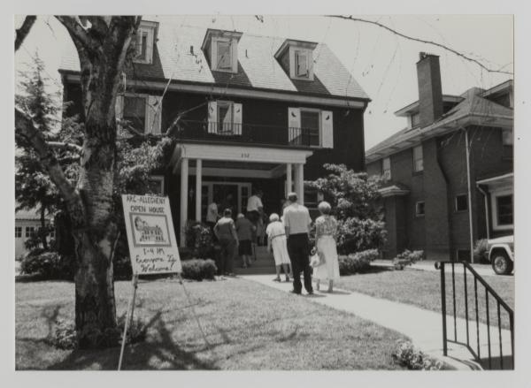 A home with a family entering in the front