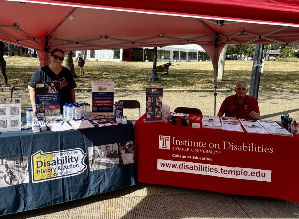 Cindy Leonard and Guy Caruso staffing tables for the Consortium and Institute on Disabilities at Temple University
