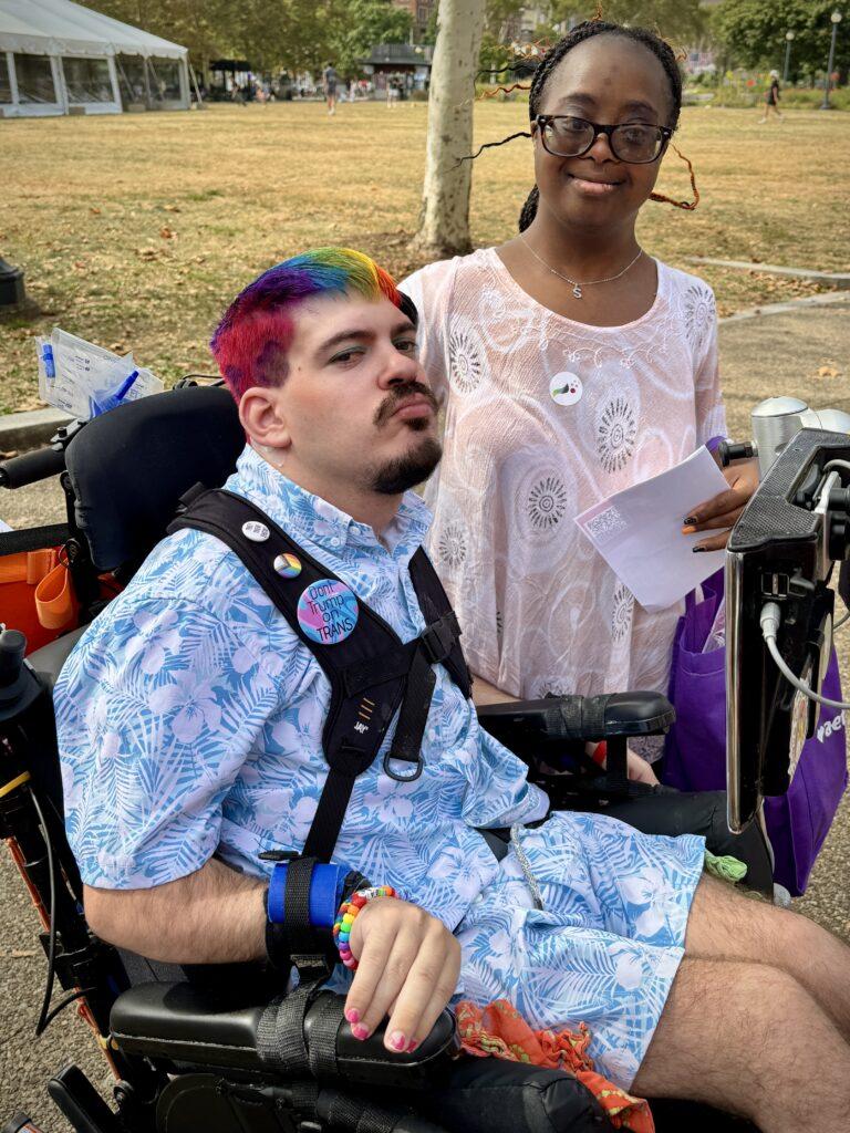Mark Steidl and a young Black woman pose for a photo together.