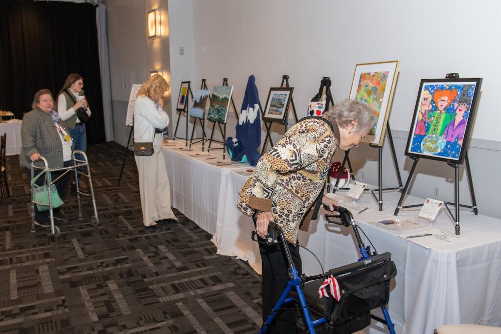 Attendees bidding on silent auction items.
