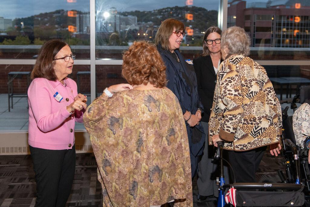 Five women chatting at the reception.