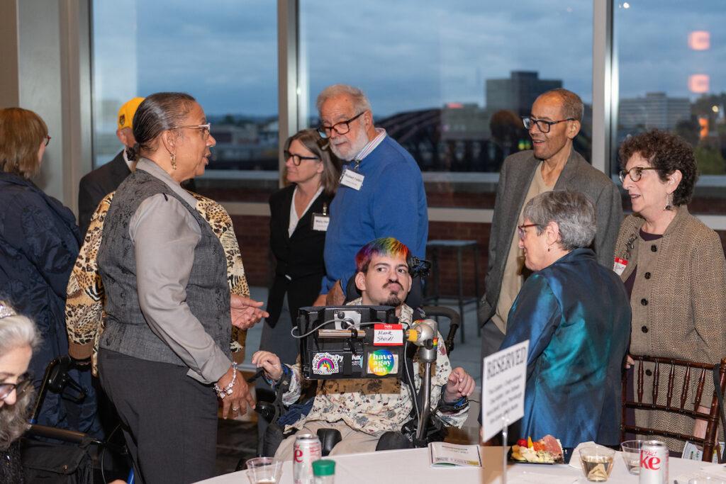 A large group of people waiting to visit with Mark Steidl.