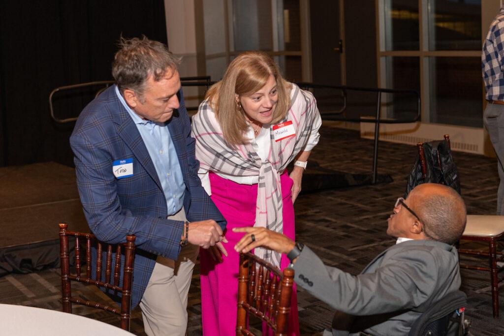 A couple talking to Chaz Kellem.