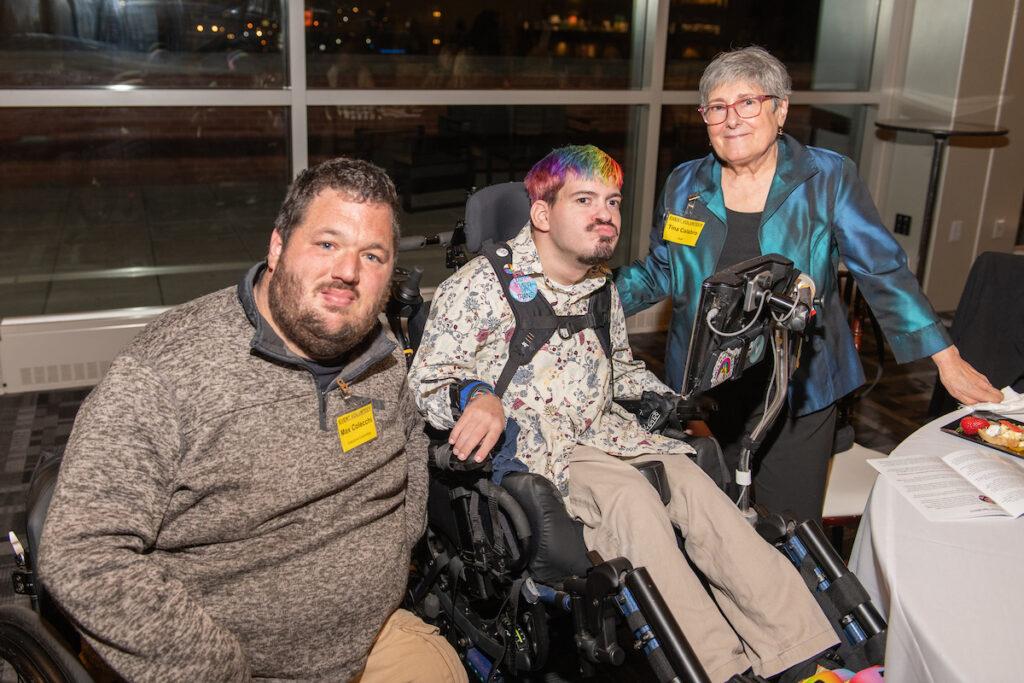 Event volunteers posing for a photo with Mark Steidl.