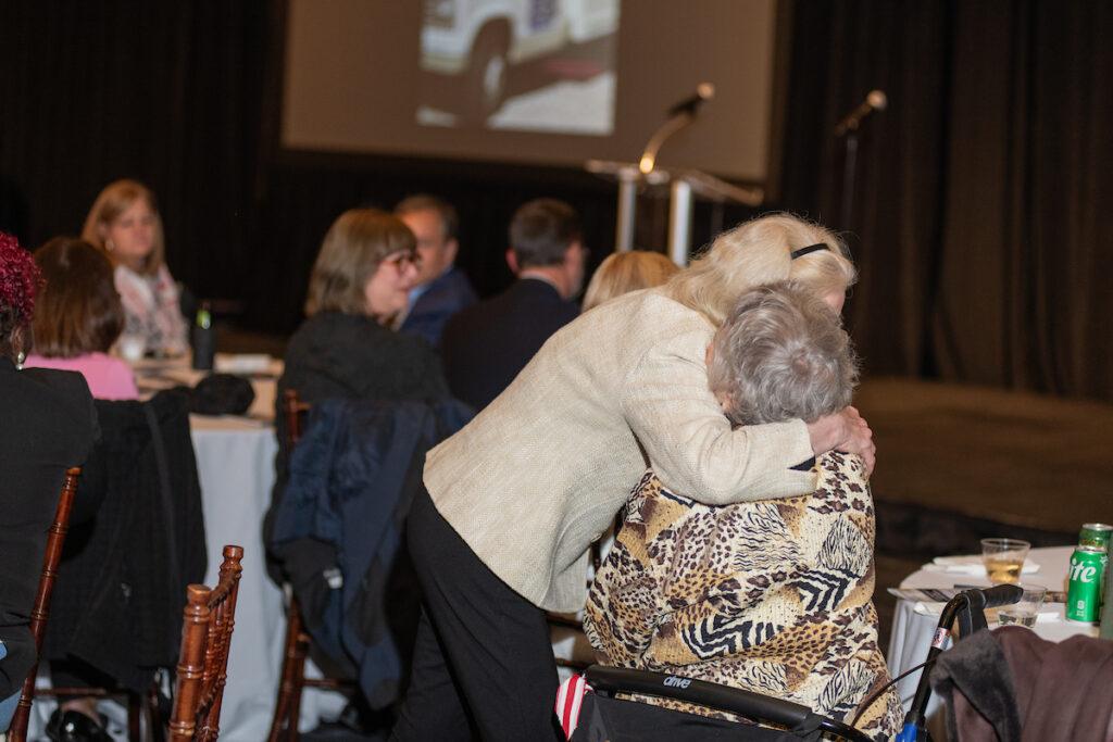 Nancy Murray hugs Ginny Thornburgh after the tribute speech.