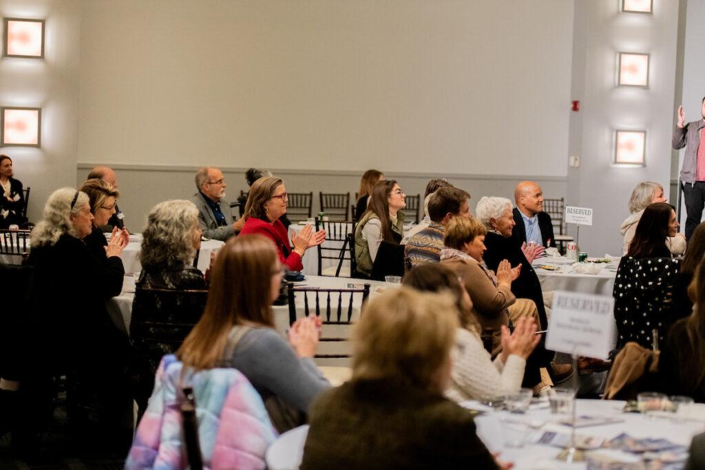 Guests applauding for Ann and Mark.