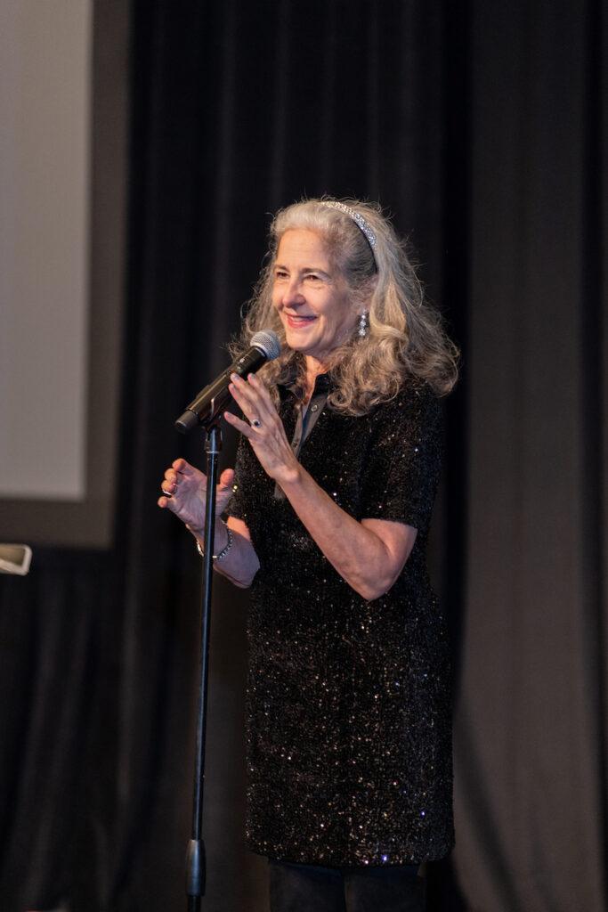 Ann Talman reenacting part of her Woodys Order one woman show.