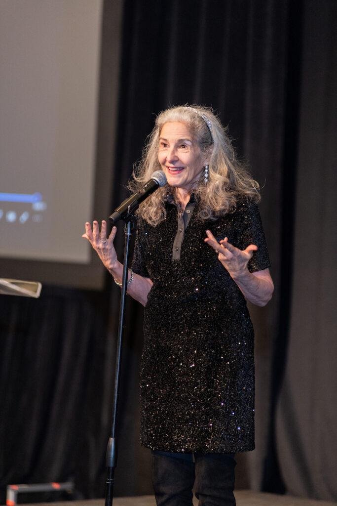 Ann Talman reenacting part of her Woodys Order one woman show.