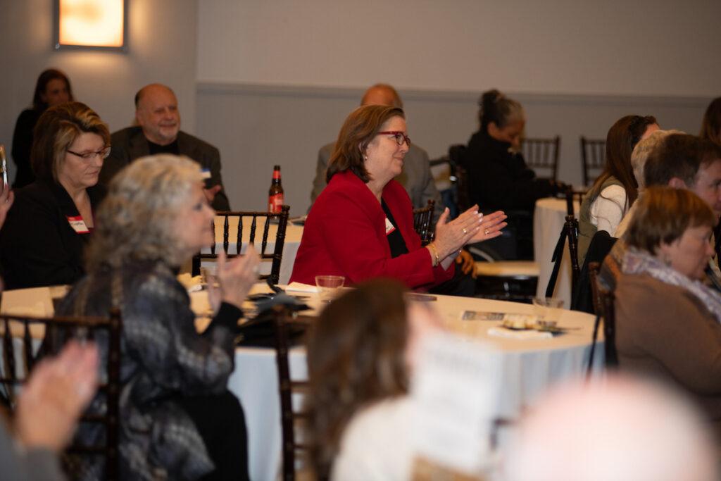 Guests applauding for Ann and Mark.