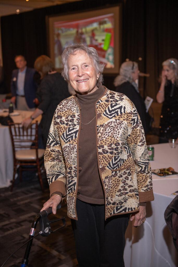 Ginny Thornburgh poses for a photo - she has a big smile on her face.