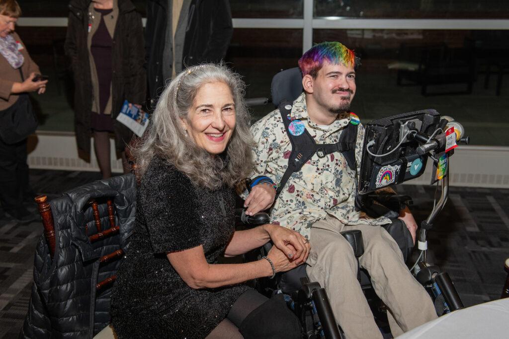 Ann Talman and Mark Steidl pose for a photo, both smiling.
