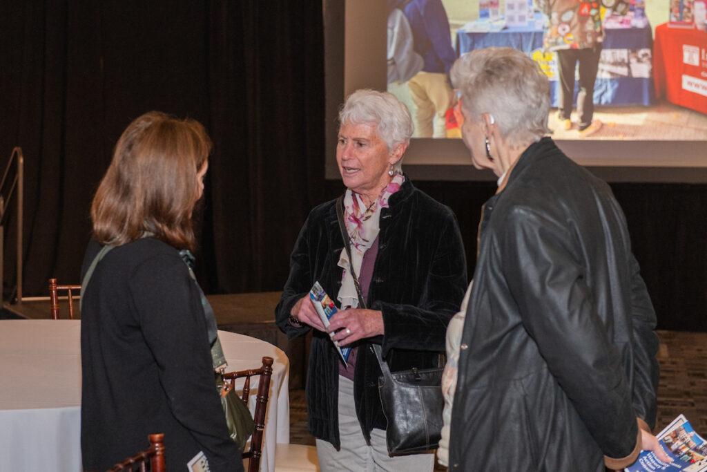 Three women chatting at the end of the event.