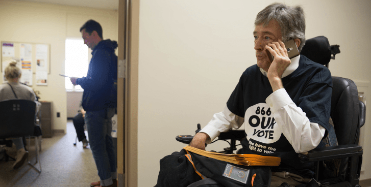 Paul O’Hanlon using the phone during a voting rights advocacy effort.